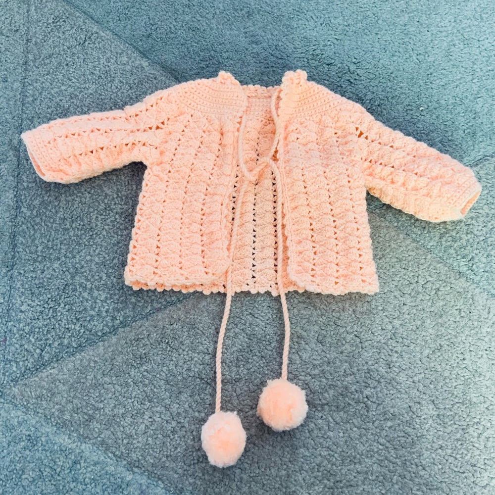 Knit Peach Baby Sweater with Pom Pom Tassels